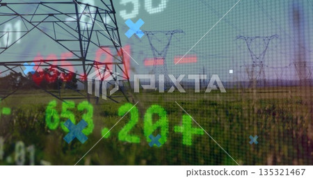 Towering steel power transmission tower rising across grassy field, displaying digital overlay data 135321467
