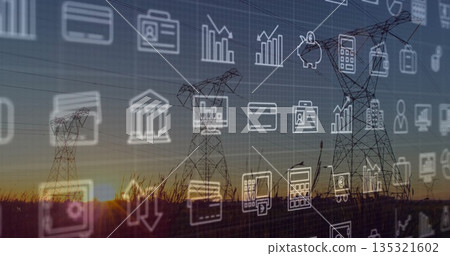 Towering trio of high-voltage towers standing in rural sunset field, showing financial or data icons 135321602