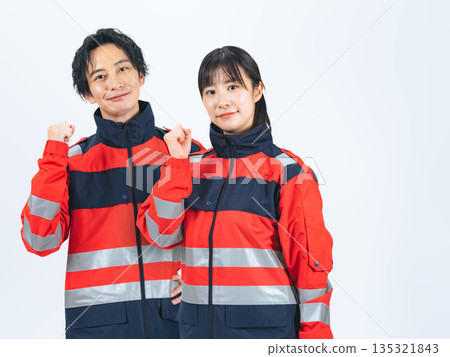 Men and women in uniforms making a fist pump 135321843