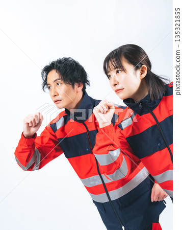 Men and women in running uniforms Men and women in running uniforms 135321855