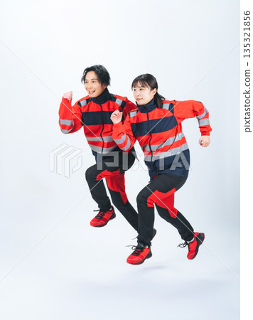 Full-body photo of a man and woman in jumping uniforms 135321856