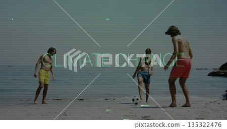 Playing beach soccer friends wearing trunks kicking ball on sandy shore, with black-and-white ball Playing beach soccer friends wearing trunks kicking ball on sandy shore, with black-and-white ball 135322476