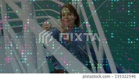 Reading woman in blue sweater holding note in rowboat on green water, with metal frame, oars Reading woman in blue sweater holding note in rowboat on green water, with metal frame, oars 135322546