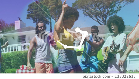 Dancing woman raising finger in garden at home, with acoustic guitar and checkered picnic table Dancing woman raising finger in garden at home, with acoustic guitar and checkered picnic table 135322635