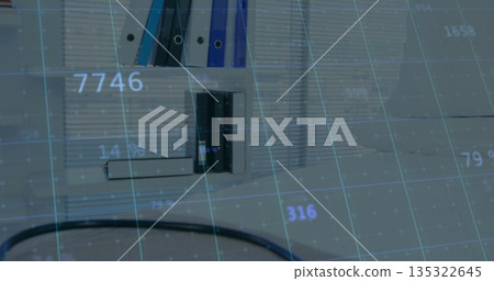 Displaying white shelving unit holding binders and files at office desk, with digital grid overlay Displaying white shelving unit holding binders and files at office desk, with digital grid overlay 135322645