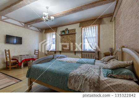 Rustic bedroom interior with brick wall niche and wooden furniture Rustic bedroom interior with brick wall niche and wooden furniture 135322842