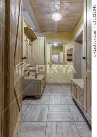 Rustic wooden hallway interior with hand-painted furniture Rustic wooden hallway interior with hand-painted furniture 135322846