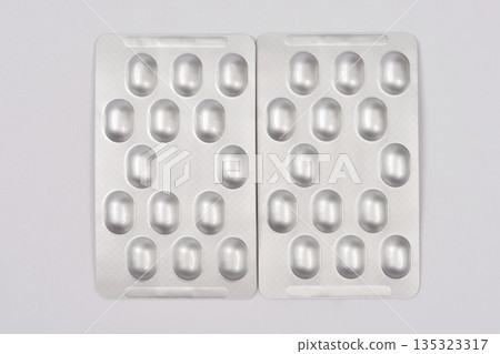 Pills in silver blister packs Pills in silver blister packs 135323317