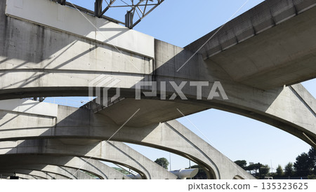 Modern concrete arches of Porto airport infrastructure. Architectural composition with curves, Modern concrete arches of Porto airport infrastructure. Architectural composition with curves, 135323625