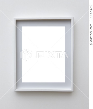 Minimalist white vertical photo frame with passe-partout on a light wall background. Perfect mockup Minimalist white vertical photo frame with passe-partout on a light wall background. Perfect mockup 135323739
