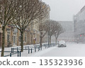 Altermarkt square Magdeburg at heavy snowfall show Rathaus architecture statues lanterns empty urban space winter storm 135323936