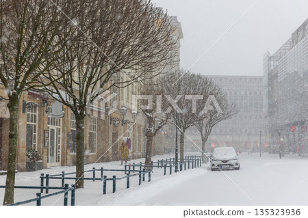 Altermarkt square Magdeburg at heavy snowfall show Rathaus architecture statues lanterns empty urban space winter storm 135323936