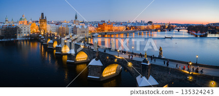 High Resolution Panorama Picture of Winter Snowy Prague Old Town with Prague Castle and Charles Bridge above River Vltava during Sunset , Czech republic High Resolution Panorama Picture of Winter Snowy Prague Old Town with Prague Castle and Charles Bridge above River Vltava during Sunset , Czech republic 135324243