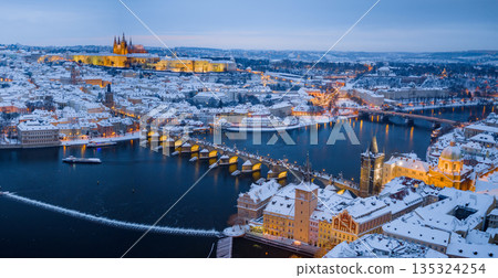 High Resolution Panorama Picture of Winter Snowy Prague Old Town with Prague Castle and Charles Bridge above River Vltava during Sunset , Czech republic 135324254