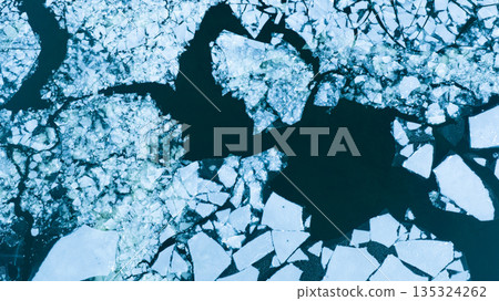 Floating ice Floes on the Frozen Surface of the River in Winter , Aerial Shot Floating ice Floes on the Frozen Surface of the River in Winter , Aerial Shot 135324262