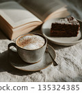 Cup of cappuccino next to a slice of chocolate cake and an open book, soft morning light, linen tablecloth, neutral warm tones 135324385