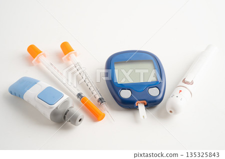 Glucometer lancet and test stick measuring human blood sugar level for diabetes. 135325843