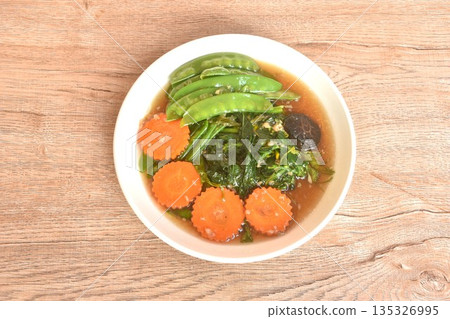 fried mixed vegetable dressing sesame oil and soy sauce with chop garlic on plate fried mixed vegetable dressing sesame oil and soy sauce with chop garlic on plate 135326995