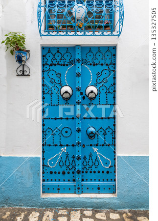 Traditional blue gate in Bizerte medina, Tunisia 135327505