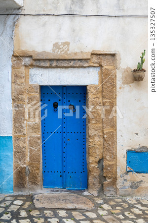 Traditional blue gate in Bizerte medina, Tunisia 135327507