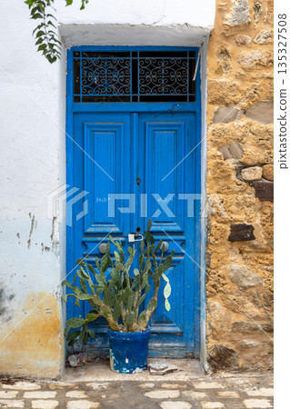 Traditional blue gate in Bizerte medina, Tunisia 135327508