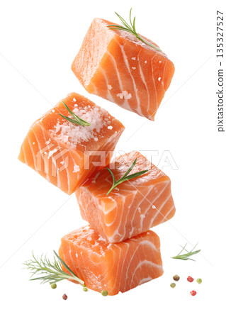 Fresh, vibrant raw salmon cubes levitating with sprigs of rosemary and sea salt crystals, isolated. Perfect for healthy recipes and gourmet concepts Fresh, vibrant raw salmon cubes levitating with sprigs of rosemary and sea salt crystals, isolated. Perfect for healthy recipes and gourmet concepts 135327527
