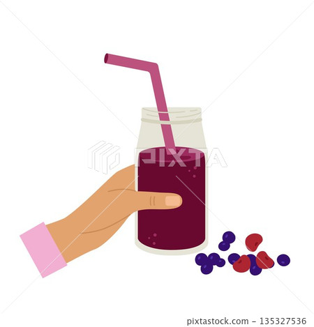 Smoothie in hand. Cocktail in a glass with whipped berries. Smoothie in hand. Cocktail in a glass with whipped berries. 135327536