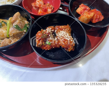 Korean cuisine: Yangnyeom chicken, bulgogi, kimchi Korean cuisine: Yangnyeom chicken, bulgogi, kimchi 135328235
