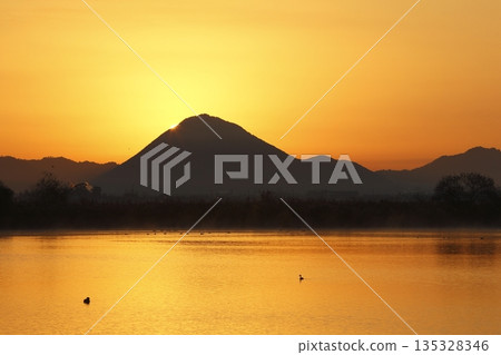 Mount Mikami at sunrise as seen from Lake Kihamauchi Mount Mikami at sunrise as seen from Lake Kihamauchi 135328346