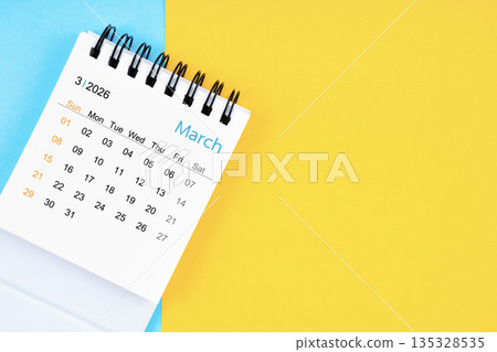March 2026, Monthly desk calendar for 2026 year on yellow and blue background. 135328535