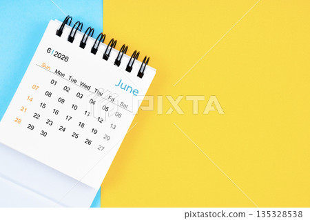 June 2026, Monthly desk calendar for 2026 year on yellow and blue background. 135328538