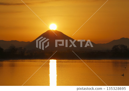 Mount Mikami at sunrise as seen from Lake Kihamauchi Mount Mikami at sunrise as seen from Lake Kihamauchi 135328695