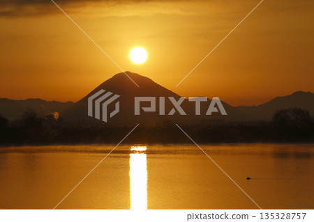 Mount Mikami at sunrise as seen from Lake Kihamauchi Mount Mikami at sunrise as seen from Lake Kihamauchi 135328757