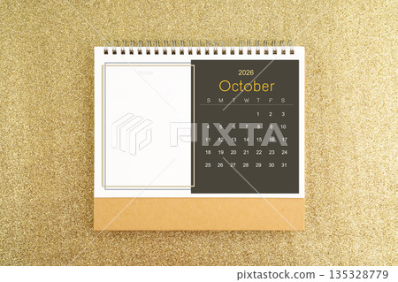 Desk calendar for October 2026 on gold color glitter. Desk calendar for October 2026 on gold color glitter. 135328779