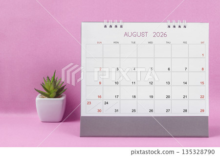 August 2026 desk calendar for year 2026 on pink background. 135328790