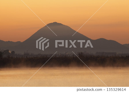 Mount Mikami at sunrise as seen from Lake Kihamauchi Mount Mikami at sunrise as seen from Lake Kihamauchi 135329614