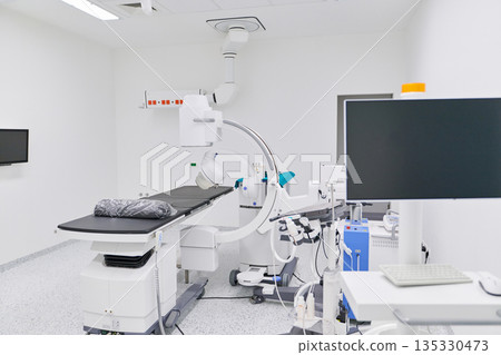 High-tech medical equipment in a modern surgical room for complex procedures High-tech medical equipment in a modern surgical room for complex procedures 135330473