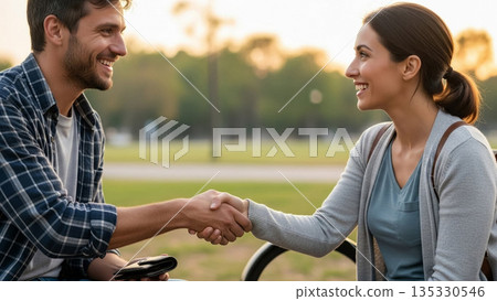 Two People Shaking Hands with Genuine Gratitude After One Helped Find the Others Lost Item, Expressing Sincere Appreciation 135330546