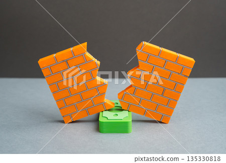 A stack of money breaks down a wall. Find the right approach. Corruption undermines the foundations of institutions and law, distorting fairness, trust and long term economic stability A stack of money breaks down a wall. Find the right approach. Corruption undermines the foundations of institutions and law, distorting fairness, trust and long term economic stability 135330818