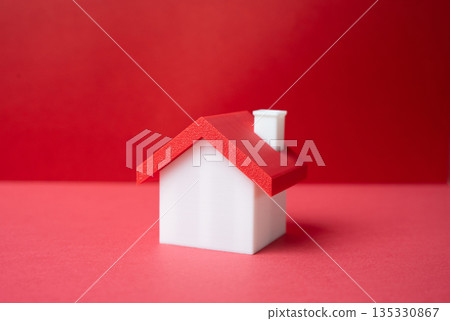 Minimalistic house on a red background. Buying a house. Real estate. Mortgage decisions. Property value. Down payment calculation. Asset growth opportunity. 135330867