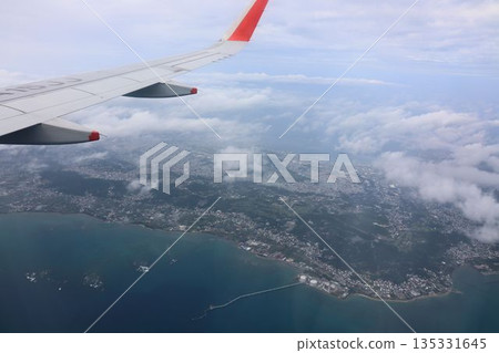 A view of the seaside town and red wings from the sky 135331645