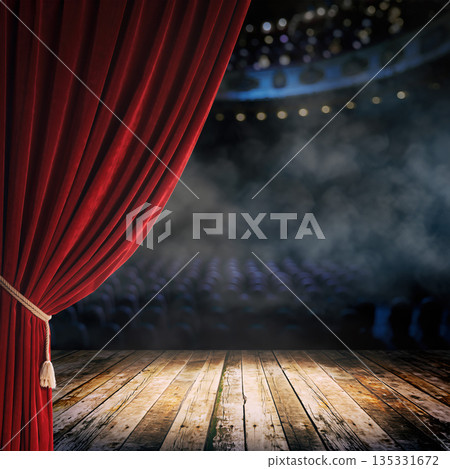 Stage with red curtain and empty seats in theater during an event at night 135331672