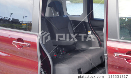 Back seat of a compact car with sliding doors 135331817