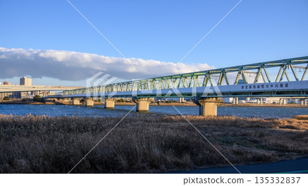 Railway bridge over a river in winter Railway bridge over a river in winter 135332837