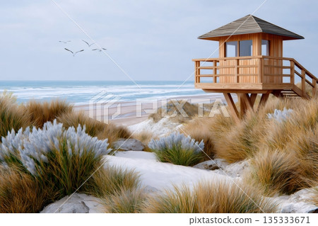 Wooden lifeguard tower overlooking tranquil beach and ocean Wooden lifeguard tower overlooking tranquil beach and ocean 135333671