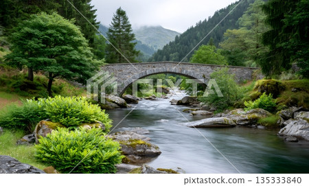 Stone arch bridge spanning river in mountain...-插圖素材 [135333840] - PIXTA圖庫