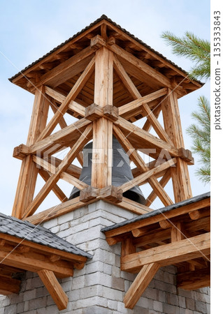 Wooden bell tower belfry with large metal bell 135333843