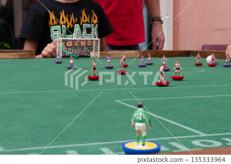 People playing Subbuteo People playing Subbuteo 135333964