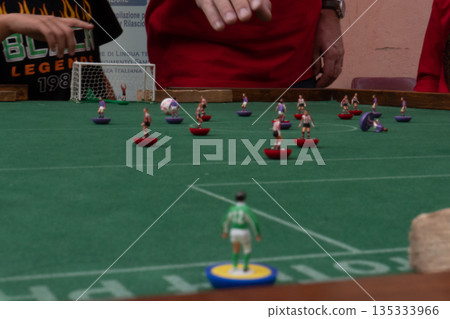 People playing Subbuteo People playing Subbuteo 135333966