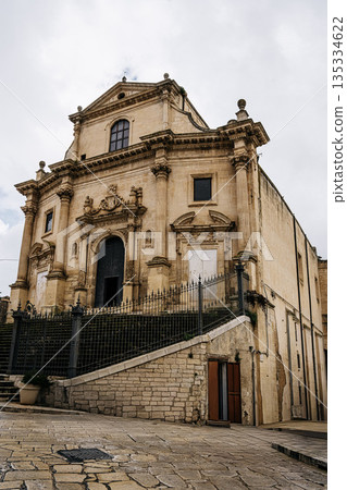 Church Of Santa Maria Dell Itria In Ragusa, Sicily: Historic Baroque Stone Facade And Bell Tower Rising Above Traditional Southern Italian Old Town Church Of Santa Maria Dell Itria In Ragusa, Sicily: Historic Baroque Stone Facade And Bell Tower Rising Above Traditional Southern Italian Old Town 135334622